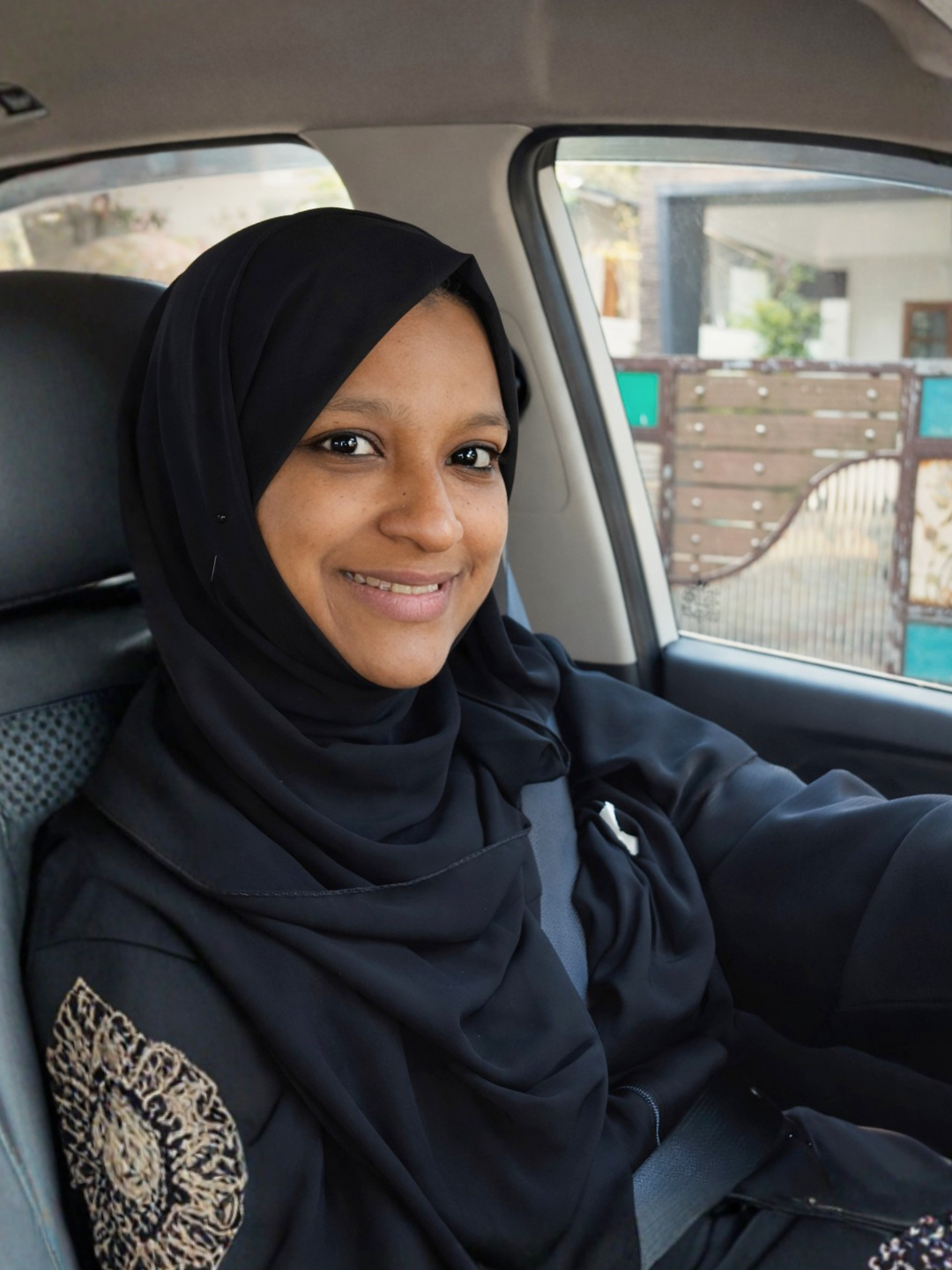 Hafza seated in a car after her Mojo Drive course